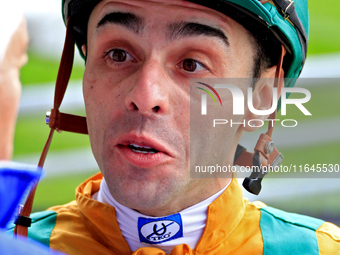 Jockey Leo Salles speaks with connections following the fifth race at Woodbine Racetrack in Toronto, Canada, on October 6, 2024. (