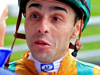 Jockey Leo Salles speaks with connections following the fifth race at Woodbine Racetrack in Toronto, Canada, on October 6, 2024. (