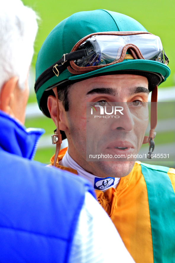 Jockey Leo Salles speaks with connections following the fifth race at Woodbine Racetrack in Toronto, Canada, on October 6, 2024. 