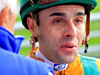 Jockey Leo Salles speaks with connections following the fifth race at Woodbine Racetrack in Toronto, Canada, on October 6, 2024. (