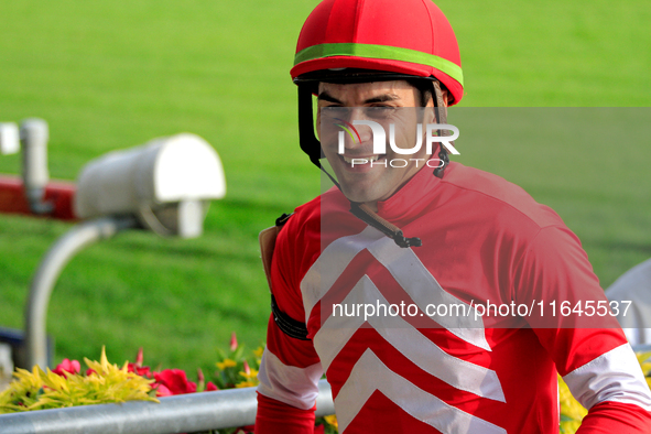 Jockey Sahin Civaci smiles as he leaves the winner's circle after a win in the seventh race at Woodbine Racetrack in Toronto, Canada, on Oct...