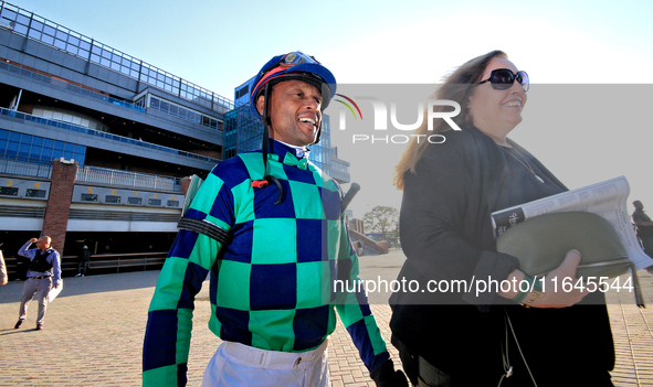 Jockey Patrick Husbands walks to the walking ring ahead of the 87th running of the $250,000 Cup & Saucer Stakes race at Woodbine Racetrack i...