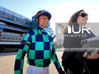 Jockey Patrick Husbands walks to the walking ring ahead of the 87th running of the $250,000 Cup & Saucer Stakes race at Woodbine Racetrack i...