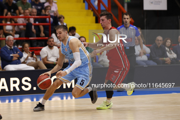 Giovanni De Nicolao of Napoli and Michele Ruzzier of Trieste are in action during the Italy Basket Serie A match between Napoli Basket and P...