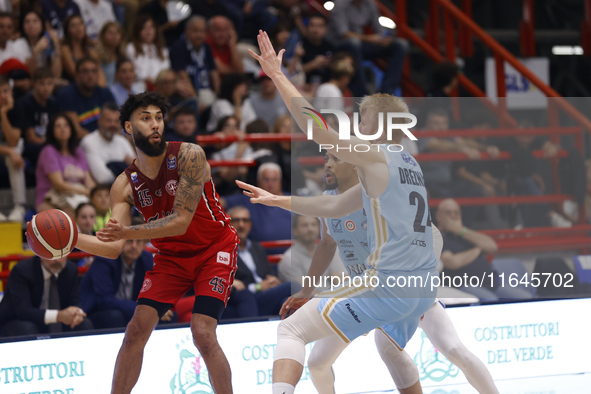 Denzel Valentine of Trieste and Dario Dreznjak of Napoli are in action during the Italy Basket Serie A match between Napoli Basket and Palla...