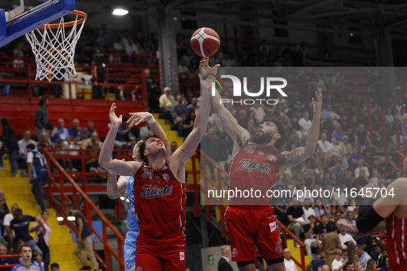 Jayce Johnson and Denzel Valentine of Trieste are in action during the Italy Basket Serie A match between Napoli Basket and Pallacanestro Tr...