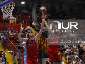 Jayce Johnson and Denzel Valentine of Trieste are in action during the Italy Basket Serie A match between Napoli Basket and Pallacanestro Tr...