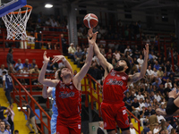 Jayce Johnson and Denzel Valentine of Trieste are in action during the Italy Basket Serie A match between Napoli Basket and Pallacanestro Tr...