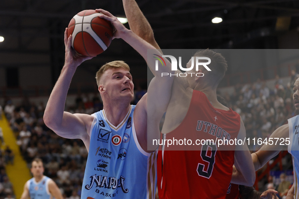 Napoli's Kaspar Treier and Trieste's Jarrod Uthoff are in action during the Italy Basket Serie A match between Napoli Basket and Pallacanest...