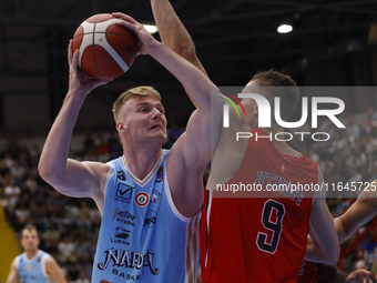 Napoli's Kaspar Treier and Trieste's Jarrod Uthoff are in action during the Italy Basket Serie A match between Napoli Basket and Pallacanest...