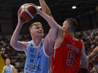 Napoli's Kaspar Treier and Trieste's Jarrod Uthoff are in action during the Italy Basket Serie A match between Napoli Basket and Pallacanest...