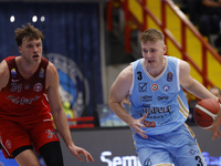 Jayce Johnson of Trieste and Kaspar Treier of Napoli are in action during the Italy Basket Serie A match between Napoli Basket and Pallacane...