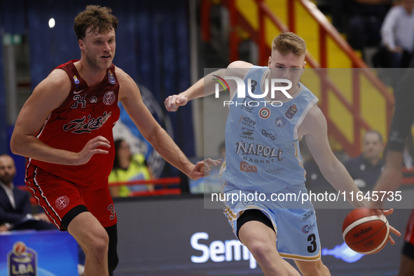 Jayce Johnson of Trieste and Kaspar Treier of Napoli are in action during the Italy Basket Serie A match between Napoli Basket and Pallacane...