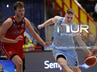 Jayce Johnson of Trieste and Kaspar Treier of Napoli are in action during the Italy Basket Serie A match between Napoli Basket and Pallacane...