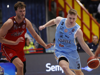 Jayce Johnson of Trieste and Kaspar Treier of Napoli are in action during the Italy Basket Serie A match between Napoli Basket and Pallacane...