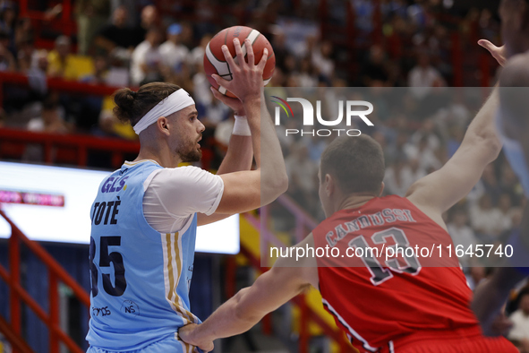 Napoli's Leonardo Tote and Trieste's Francesco Candussi are in action during the Italy Basket Serie A match between Napoli Basket and Pallac...