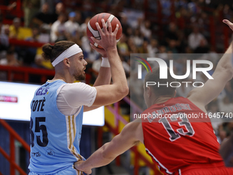 Napoli's Leonardo Tote and Trieste's Francesco Candussi are in action during the Italy Basket Serie A match between Napoli Basket and Pallac...