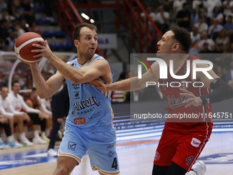 Napoli's Kevin Pangos and Trieste's Colbey Ross are in action during the Italy Basket Serie A match between Napoli Basket and Pallacanestro...