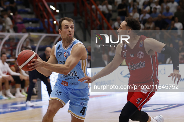 Napoli's Kevin Pangos and Trieste's Colbey Ross are in action during the Italy Basket Serie A match between Napoli Basket and Pallacanestro...