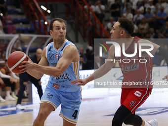 Napoli's Kevin Pangos and Trieste's Colbey Ross are in action during the Italy Basket Serie A match between Napoli Basket and Pallacanestro...