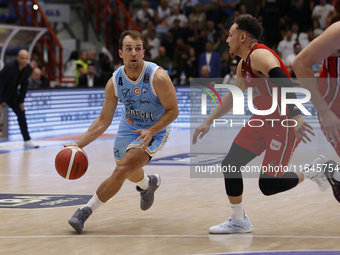 Napoli's Kevin Pangos and Trieste's Colbey Ross are in action during the Italy Basket Serie A match between Napoli Basket and Pallacanestro...