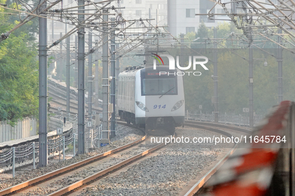 A photo taken on October 4, 2024, shows the Line 9 train of Tianjin Rail Transit in Tianjin, China. According to the Ministry of Transport,...