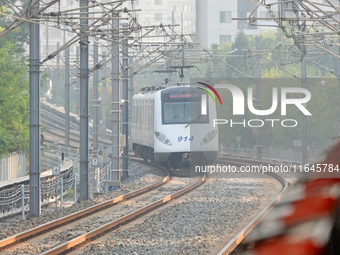 A photo taken on October 4, 2024, shows the Line 9 train of Tianjin Rail Transit in Tianjin, China. According to the Ministry of Transport,...