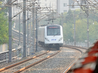 A photo taken on October 4, 2024, shows the Line 9 train of Tianjin Rail Transit in Tianjin, China. According to the Ministry of Transport,...