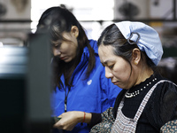 A worker produces pencils at the production workshop of China First Pencil Sihong Co., LTD in Sihong Economic Development Zone in Suqian, Ji...