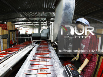 A worker produces pencils at the production workshop of China First Pencil Sihong Co., LTD in Sihong Economic Development Zone in Suqian, Ji...