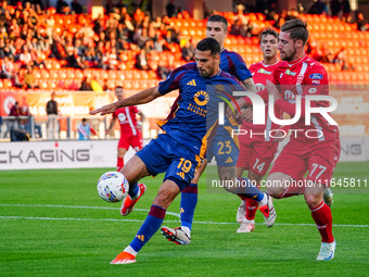 Zeki Celik (AS Roma) and Georgios Kyriakopoulos (AC Monza) participate in the Italian championship Serie A football match between AC Monza a...