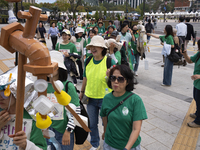 Around 50 participants from Consumer Climate Action and Seoul iCOOP Cooperative gather in front of Daehanmun Gate, Deoksugung Palace, to cal...