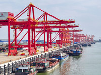 Cranes carry out loading and unloading operations in an orderly manner at the Yaowan Comprehensive Terminal in Nanchang, China, on October 6...