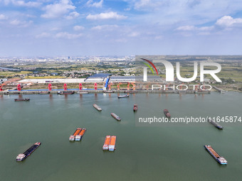 Cranes carry out loading and unloading operations in an orderly manner at the Yaowan Comprehensive Terminal in Nanchang, China, on October 6...