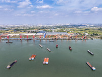 Cranes carry out loading and unloading operations in an orderly manner at the Yaowan Comprehensive Terminal in Nanchang, China, on October 6...