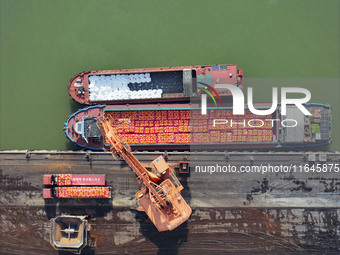 Cranes carry out loading and unloading operations in an orderly manner at the Yaowan Comprehensive Terminal in Nanchang, China, on October 6...