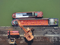 Cranes carry out loading and unloading operations in an orderly manner at the Yaowan Comprehensive Terminal in Nanchang, China, on October 6...