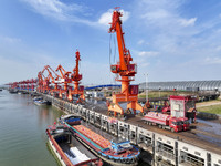 Cranes carry out loading and unloading operations in an orderly manner at the Yaowan Comprehensive Terminal in Nanchang, China, on October 6...