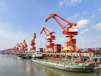 Cranes carry out loading and unloading operations in an orderly manner at the Yaowan Comprehensive Terminal in Nanchang, China, on October 6...