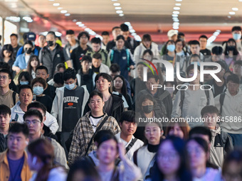 Passengers exit Nanjing Railway Station in Nanjing, China, on October 7, 2024. (