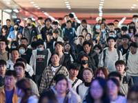 Passengers exit Nanjing Railway Station in Nanjing, China, on October 7, 2024. (