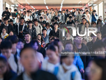 Passengers exit Nanjing Railway Station in Nanjing, China, on October 7, 2024. (