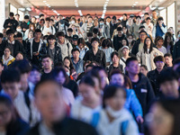 Passengers exit Nanjing Railway Station in Nanjing, China, on October 7, 2024. (