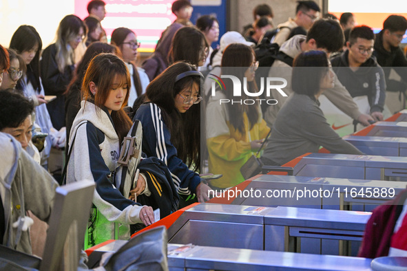 Passengers exit Nanjing Railway Station in Nanjing, China, on October 7, 2024. 