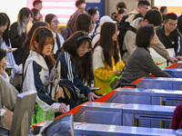 Passengers exit Nanjing Railway Station in Nanjing, China, on October 7, 2024. (