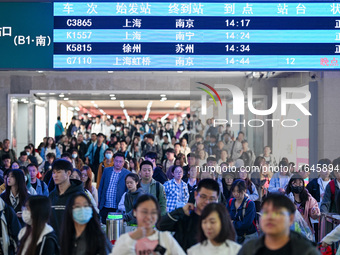 Passengers exit Nanjing Railway Station in Nanjing, China, on October 7, 2024. (