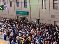 Passengers exit Nanjing Railway Station in Jiangsu province, China, on October 7, 2024. (