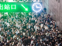 Passengers exit Nanjing Railway Station in Jiangsu province, China, on October 7, 2024. (