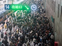 Passengers exit Nanjing Railway Station in Jiangsu province, China, on October 7, 2024. (