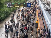 Passengers exit Nanjing Railway Station in Jiangsu province, China, on October 7, 2024. (